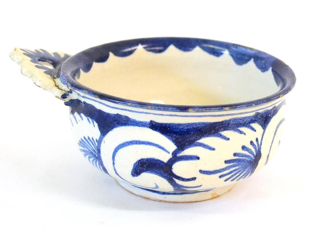 Lot 5 - A Delft Porringer, probably early 18th century, of circular form with single pierced lug...