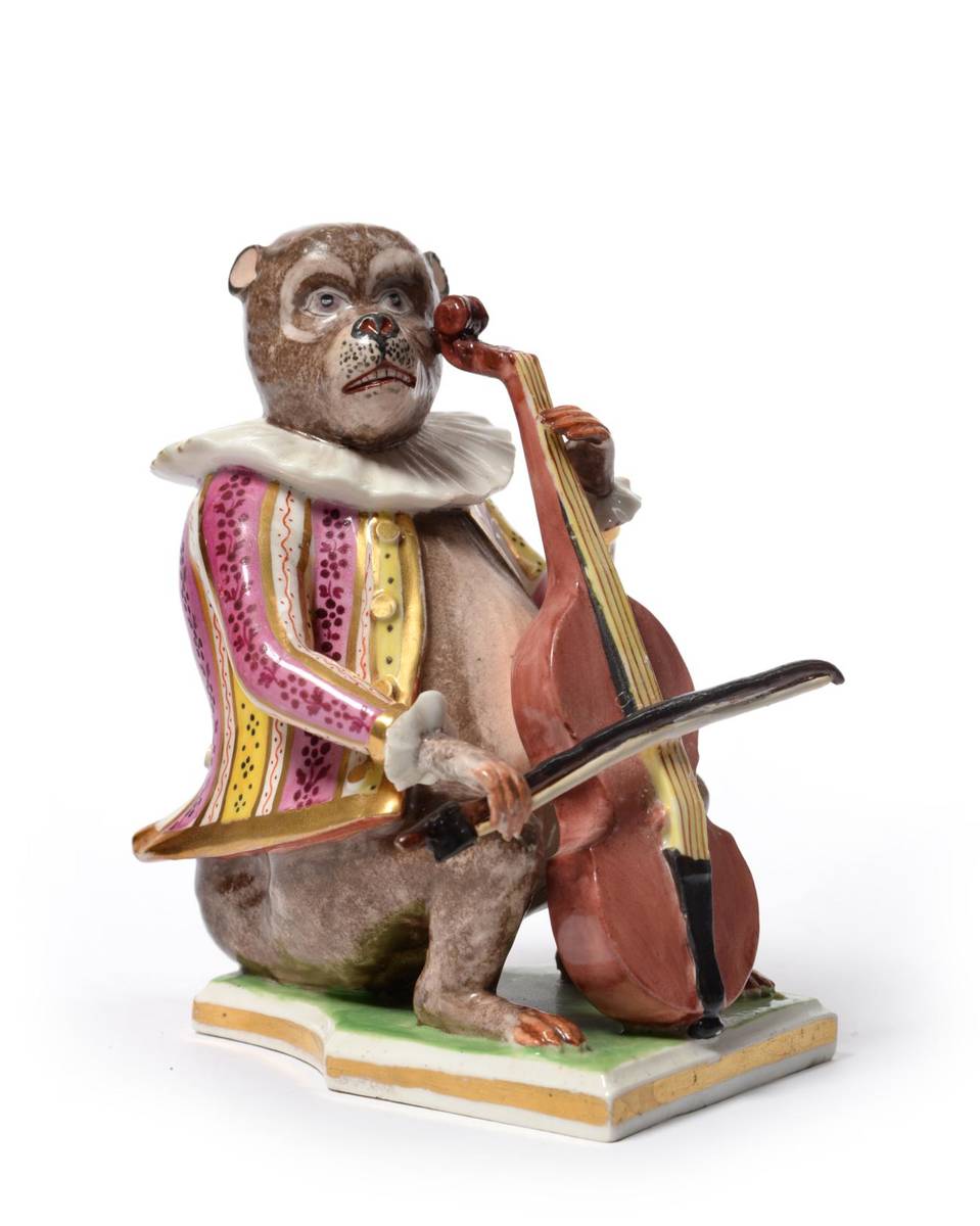 Lot 15 - A Derby Porcelain Monkey Band Figure, circa 1790, the seated figure wearing a striped jacket...