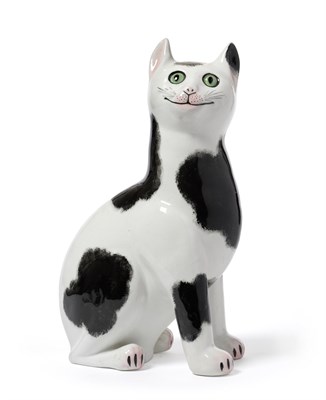 Lot 30 - A Wemyss Pottery Cat, 20th century, the seated animal with glass eyes and black markings,...