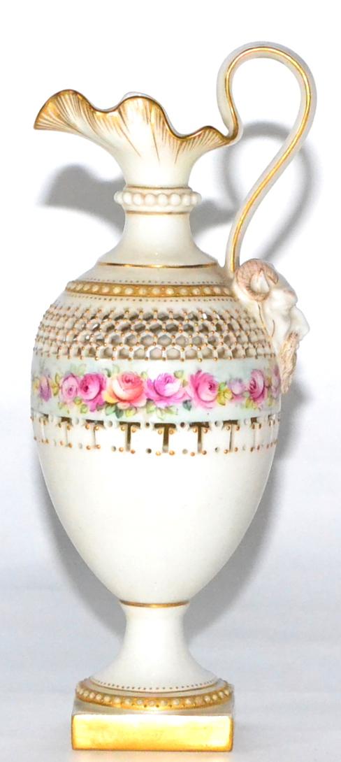 Lot 35 - A Royal Worcester Porcelain Ewer, 1899, of baluster form with mask handle, painted with a band...