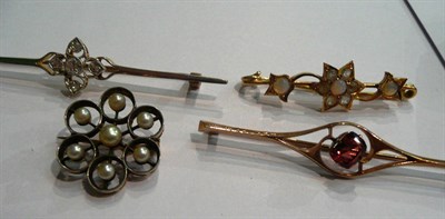 Lot 15 - A diamond cluster brooch, a pearl cluster brooch and two bar brooches