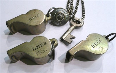 Lot 44 - Three guardman's railway whistles stamped 'LNER', BR (E) and BR (E)