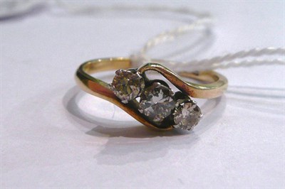 Lot 46 - A diamond three stone twist ring