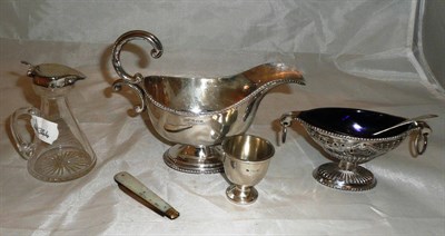 Lot 49 - Silver sauce boat, silver salt, whisky jug, mother of pearl penknife etc