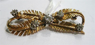 Lot 51 - A diamond and gold fern bow brooch