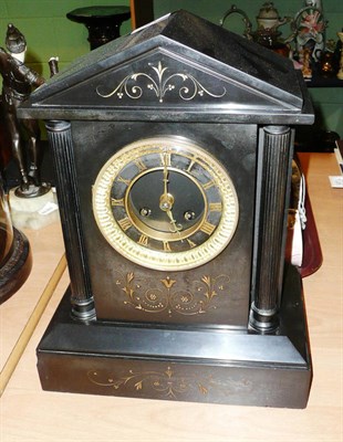 Lot 84 - A black striking mantel clock