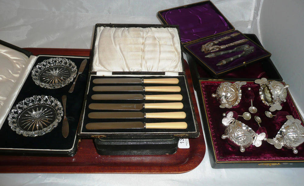 Lot 136 - Plate salts, cased, a quantity of tea knives and servers, nutcrackers and butter dishes