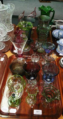 Lot 141 - Two trays of assorted coloured glass including a Mary Gregory green glass ewer