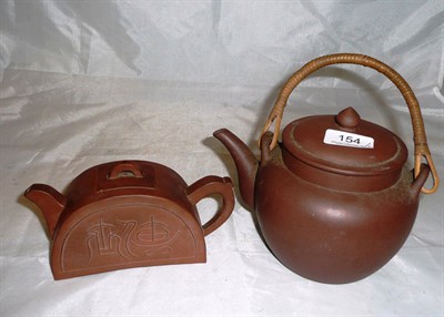 Lot 154 - Two Chinese terracotta teapots