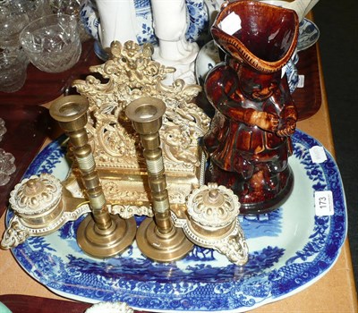 Lot 173 - A snuff taker, a Toby jug, a blue and white meat dish, a pair of brass candlesticks and a...