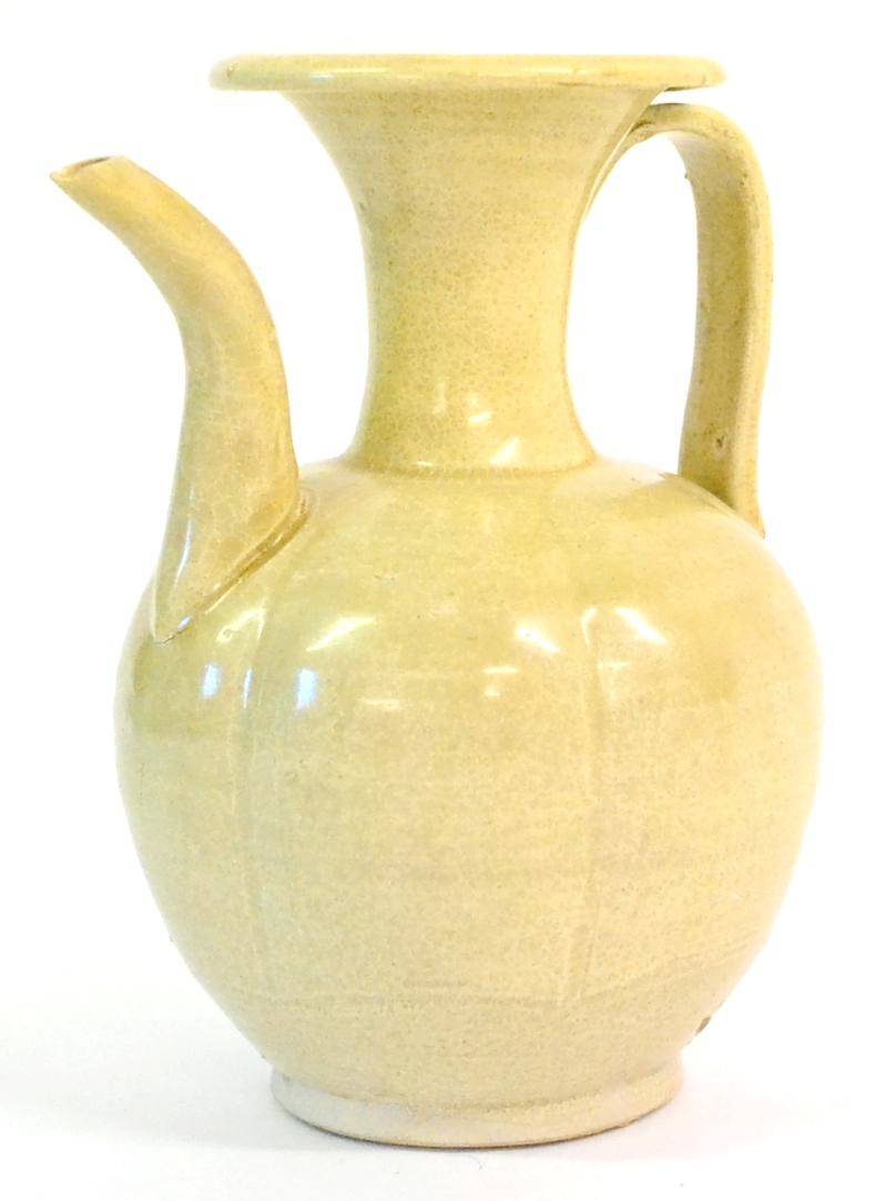 Lot 68 - A Chinese Celadon Ewer, possibly Song Dynasty, of melon fluted ovoid form with flared neck and...