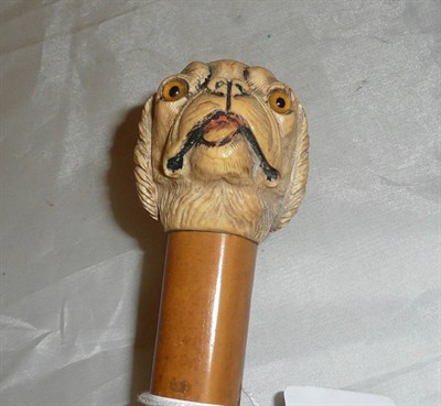 Lot 184 - Carved ivory walking stick with dog handle