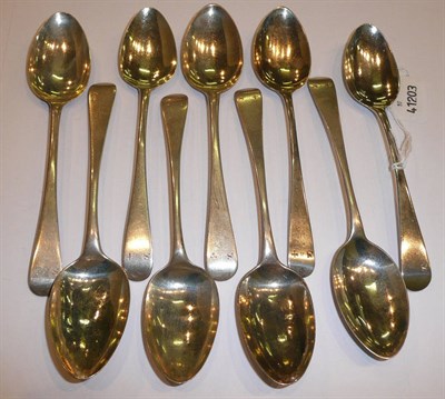 Lot 209 - Nine Old English pattern silver dessert spoons