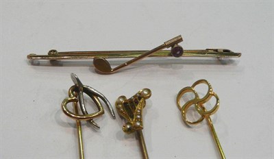 Lot 228 - Three stick pins and a tie pin