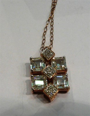 Lot 229 - A 9ct rose gold diamond set pendant on chain