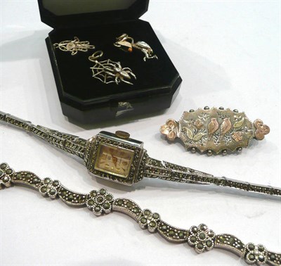 Lot 233 - A marcasite dress watch, bracelet, silver brooch and three silver charms