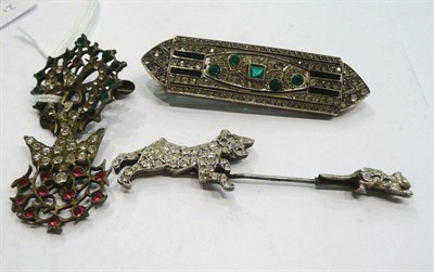 Lot 257 - An Art Deco paste brooch, a paste bird and bow brooch and a paste cat and dog brooch (3)