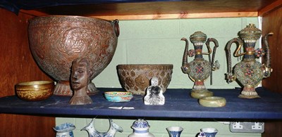 Lot 265 - A shelf of Eastern items including a Repousse planter, pair of ewers, small bowl and tribal bust