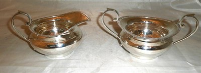 Lot 275 - Silver gadrooned sugar bowl and matching milk jug, 16oz