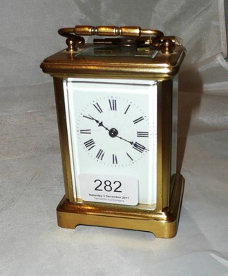 Lot 282 - A brass carriage clock with key