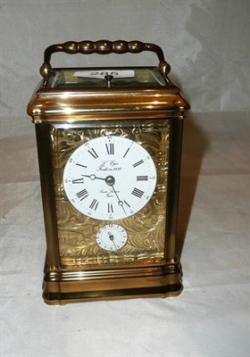 Lot 285 - A brass striking and repeating alarm carriage clock signed L'Epee