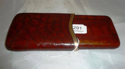 Lot 291 - A crocodile skin leather cigar case with 15ct gold rim