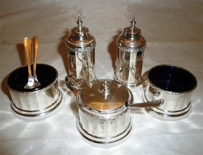 Lot 309 - A silver five piece condiment set and three matched spoons