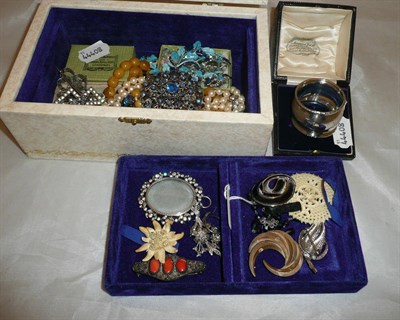 Lot 314 - A box containing costume jewellery including a brooch by Trifari, other brooches, necklaces etc and