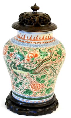 Lot 82 - A Chinese Wucai Jar, 17th century, of baluster form, painted with phoenix amongst flowering...