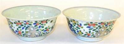 Lot 83 - A Pair of Chinese Wucai Porcelain Bowls, painted with fruiting branches issuing from rockwork,...