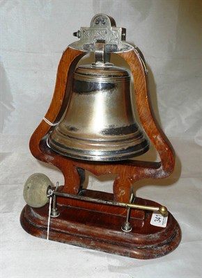 Lot 341 - A silver plate and oak table bell and beater