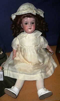 Lot 361 - Armand Marseille 390 bisque socket head doll in cream silk dress with leatherette boots and socks