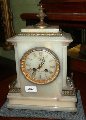 Lot 382 - An onyx striking mantel clock