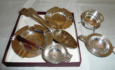 Lot 401 - Two silver tea strainers, pair of berry spoons and two silver ash trays (6), 13oz