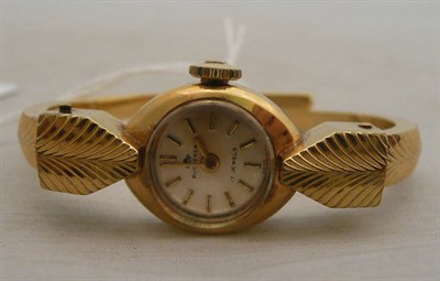 Lot 403 - A lady's steel and gilt wristwatch signed Bucherer with paperwork