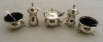 Lot 407 - A five piece silver condiment set