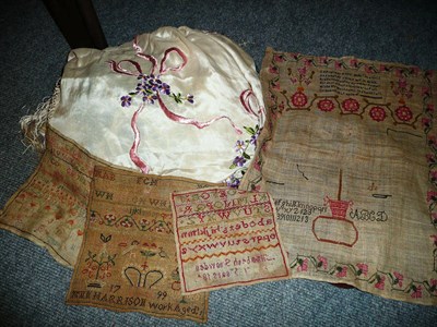 Lot 419 - Two early 20th century silk throws and four unframed samplers