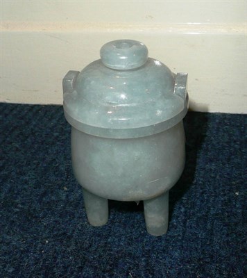 Lot 431 - A small jade type vase on three legs