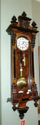 Lot 488 - A double weight driven Vienna type wall clock with two weights and pendulum