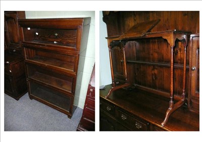 Lot 497 - A Globe Wernicke sectional bookcase and a small reading table