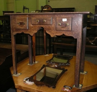 Lot 528 - A Georgian oak lowboy