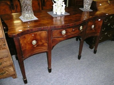 Lot 544 - George III mahogany serpentine front sideboard, reduced in height