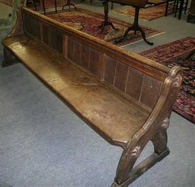 Lot 546 - A large oak church pew