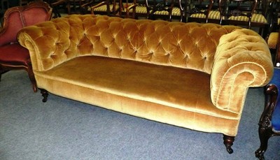 Lot 554 - A Victorian Chesterfield sofa upholstered in button back fabric