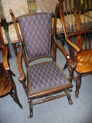 Lot 560 - Stained beech rocking chair