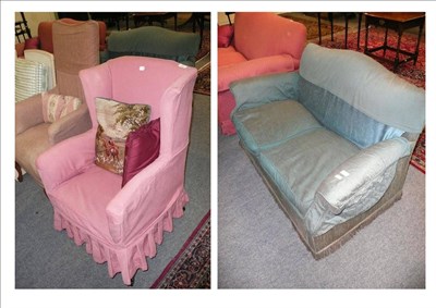 Lot 565 - Small blue sofa, small pink wing chair and a tall armchair, with needlework cushion and one other