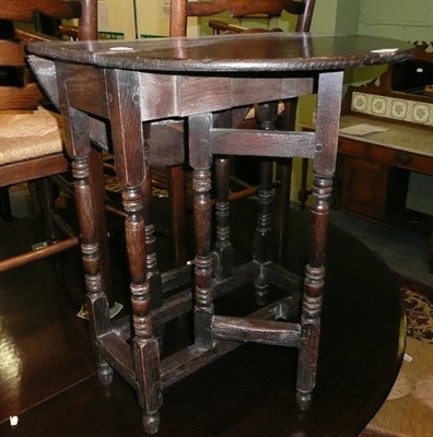 Lot 588 - Small elm and ash gate-leg table