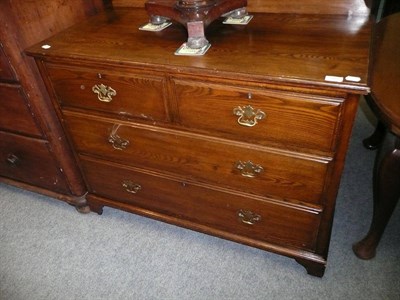 Lot 595 - Stained pine three height chest of drawers