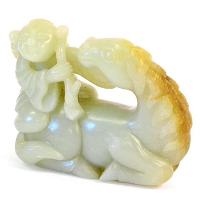 Lot 115 - A Chinese Jade Figure Group, as a boy holding a fruiting branch sitting on the back of a...