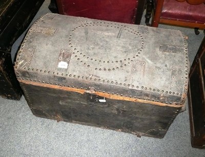 Lot 684 - A dome top trunk covered in studded leather poor condition